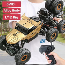 Gold and black 6WD RC truck with controller for high-speed off-road driving and garden racing.