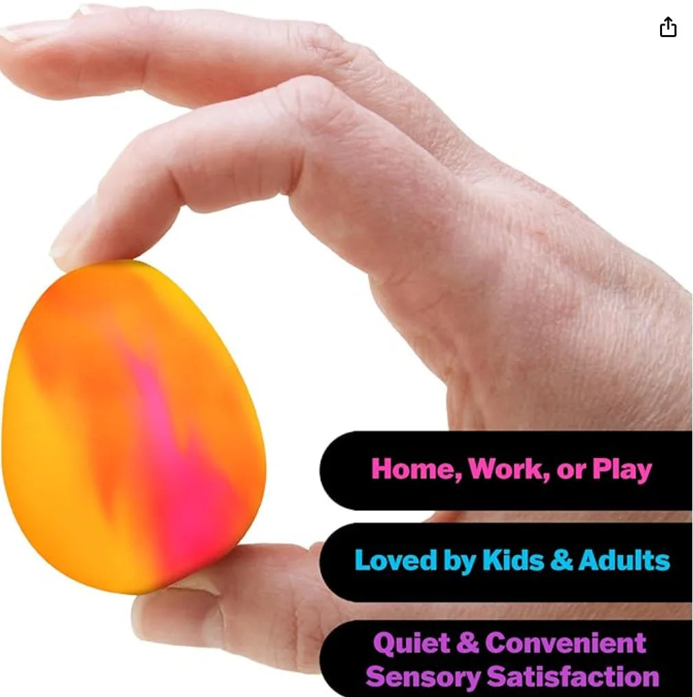 Hand holding a colorful stress ball with text about its uses.