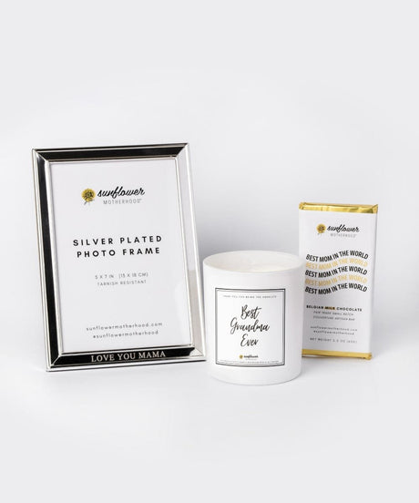 Silver photo frame, candle, and chocolate bar.