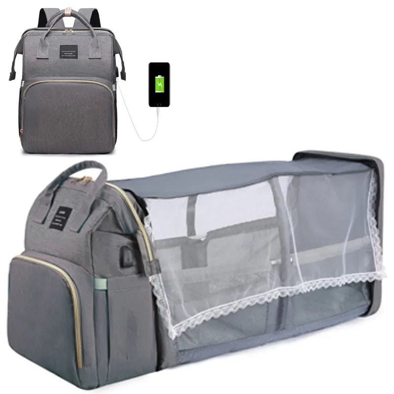 Mommy travel backpack with baby bed in gray, featuring a USB charging port and crib extension.