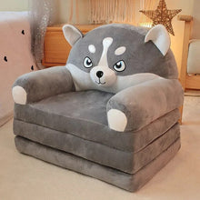 Gray wolf plush stuffed animal baby support seat placed in a nursery for babies learning to sit.