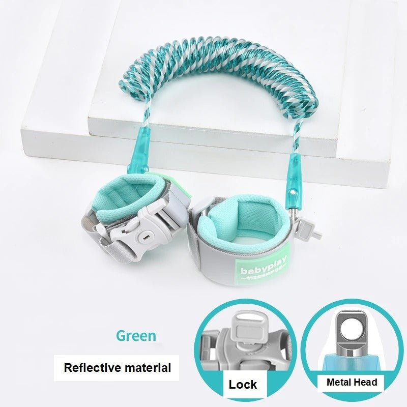 Green baby anti-lost wrist link harness with reflective strap and lock for safe stroller walks and outdoor outings.