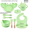 Green baby crab utensil set with plate, bowl, and cup, a full dining kit for weaning and nursery meals.