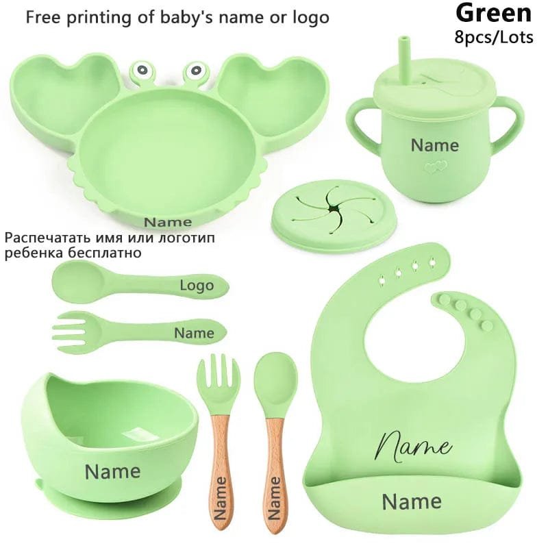 Green baby crab utensil set with plate, bowl, and cup, a full dining kit for weaning and nursery meals.