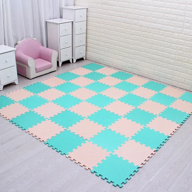 Green and beige EVA foam puzzle mat providing a comfortable floor for toddler play.
