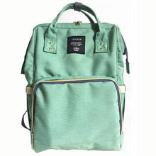 Green maternity diaper bag storage view highlighting large capacity for baby essentials.