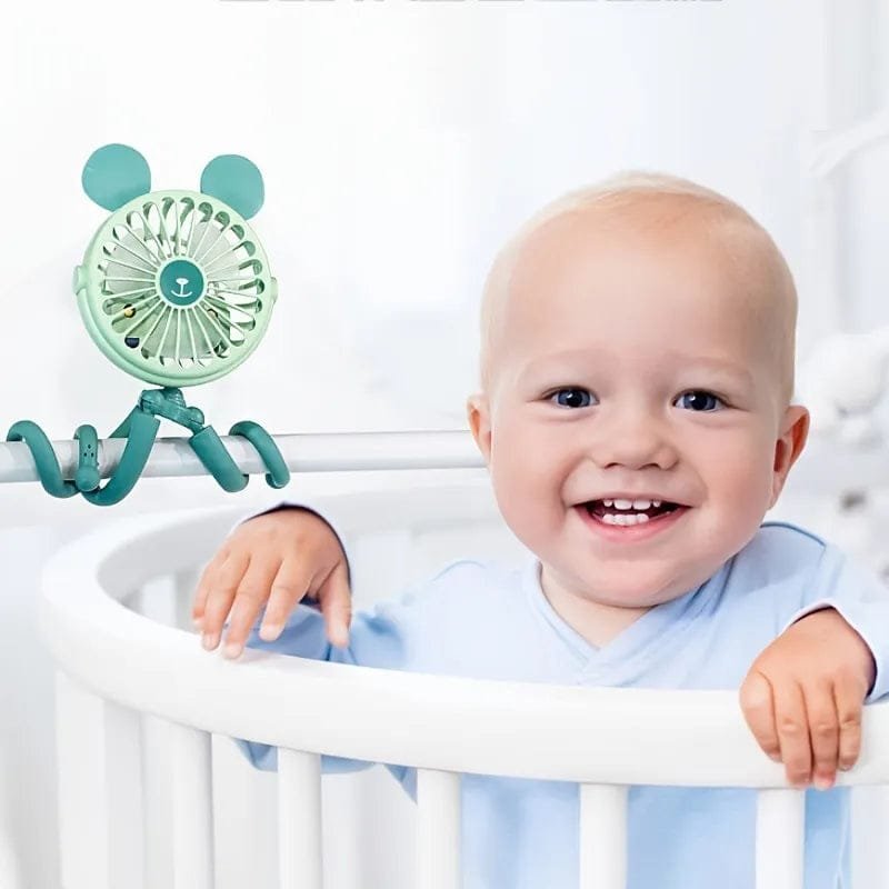 Green octopus fan attached to a crib rail to keep baby comfortable during naps, nursery play, and warm nights.