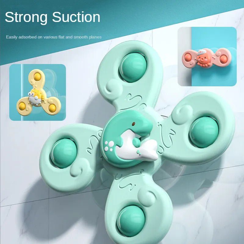 Green suction cup cartoon bath fidget spinner for infants exploring colours and textures in the tub.