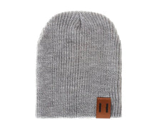 Grey crochet baby beanie hat from a second view for parents comparing colours for winter dressing.