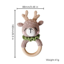 Grey deer crochet baby rattle and teether ring, a neutral nursery toy for newborn gifting and gum soothing.