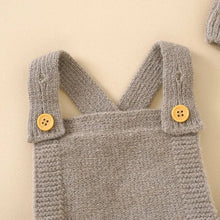 Grey knitted baby romper with yellow buttons for neutral everyday outfits, nursery wear, and gentle layering.