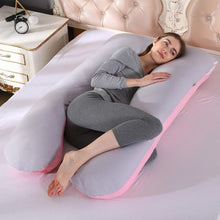 Grey and pink two tone U shaped maternity body pillow for supported sleeping and daytime relaxing at home.