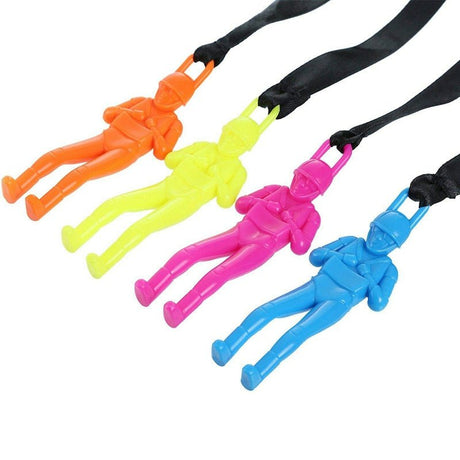 Four colorful plastic figures attached to black lanyards.