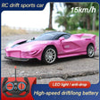 Pink RC drift sports car with remote control on a road