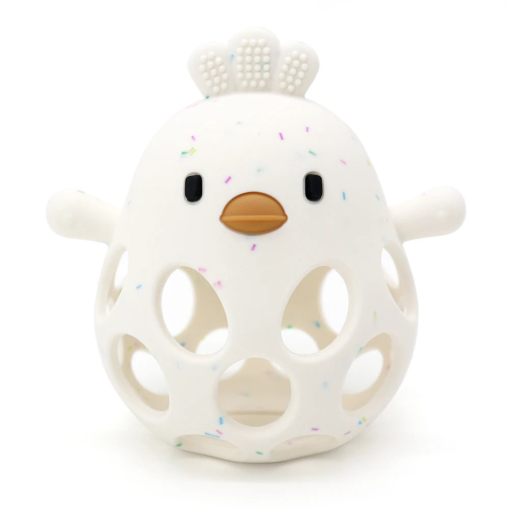 White hollow silicone chick teether with a textured comb and small speckles