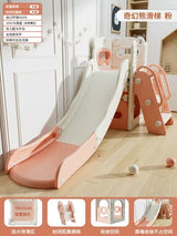 Children's slide with pink base and white top in a room setting