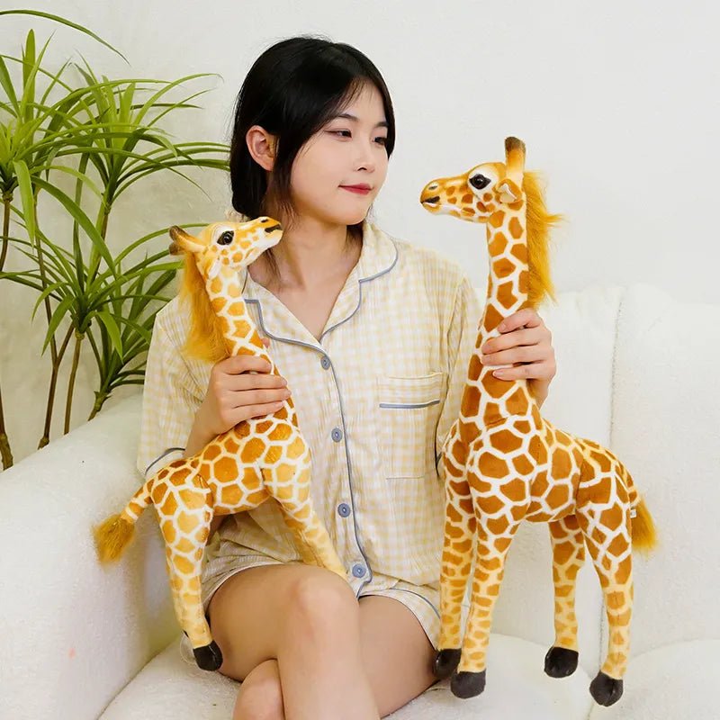 Woman holding two plush giraffes in a home setting 