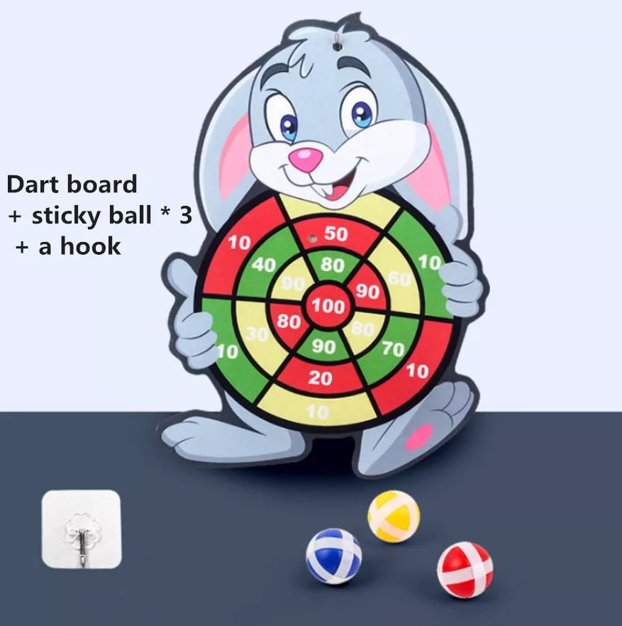 A dartboard with a cartoon character holding it, accompanied by three sticky balls and a hook.