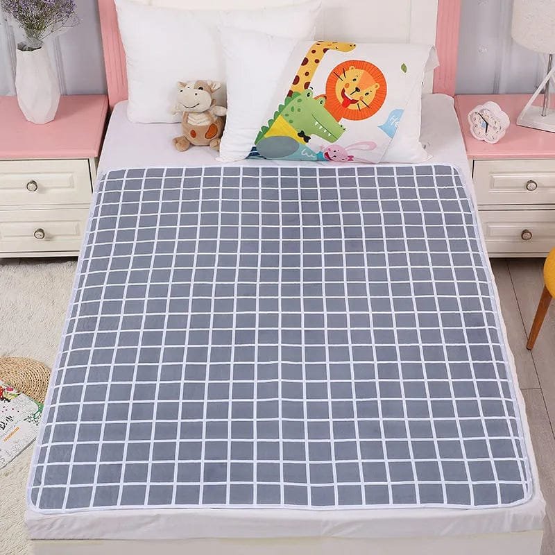 Grey grid print infant changing mat, a waterproof non-slip cover for cots, beds, and floor nappy changing stations.