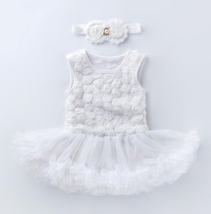 White baby dress with floral details and a matching headband