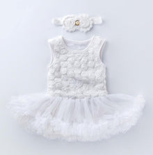 White baby dress with floral details and a matching headband