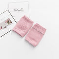 Pink baby knee pads for hard floor crawling protection at home, nursery, and grandparents houses.