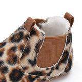 Leopard print slipper with brown interior