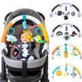 Infant stroller arch toy with chimes and squeaker attached for on-the-go sensory play.