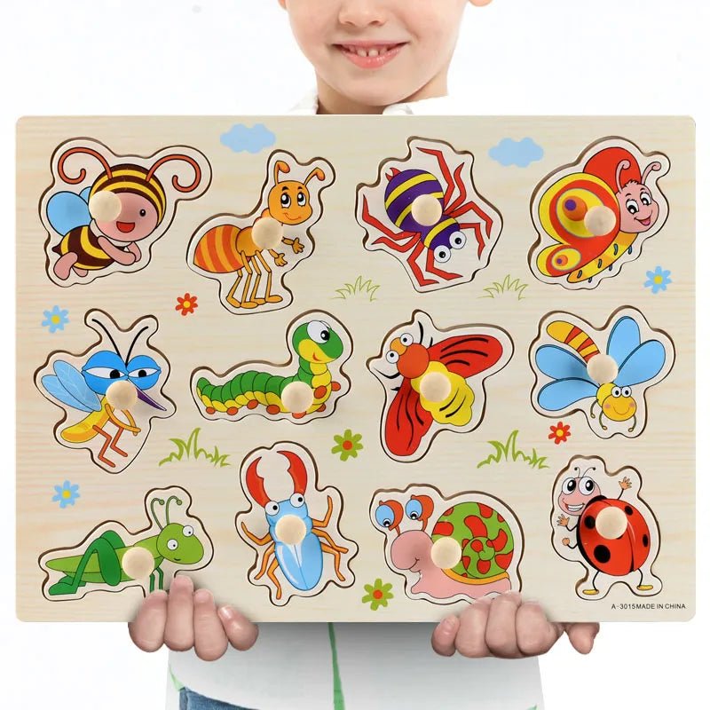 Child holding a Montessori wooden insect illustration puzzle with a simple design for early learning.