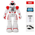 White and red robot toy with USB cable and instruction manual 