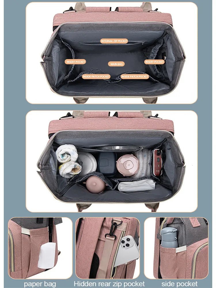 Multifunction folding mommy bag with baby bed opened to show interior storage compartments.