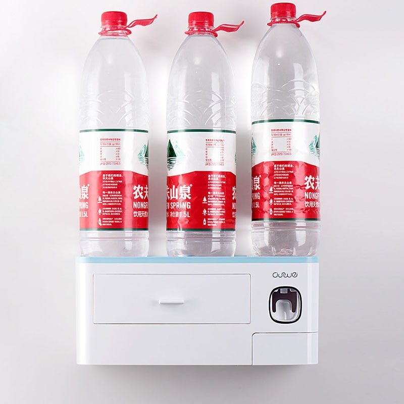 Three bottles of Nongfu Spring water on a white wall-mounted dispenser.