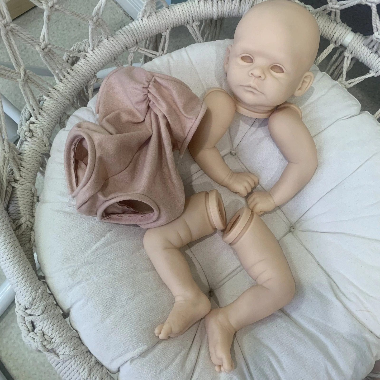 Joleen reborn doll kit with pink outfit for DIY doll crafting, painting and collectible display.
