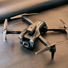 K9 Mini Drone in black with propellers close-up for FPV RC quadcopter flight detail.