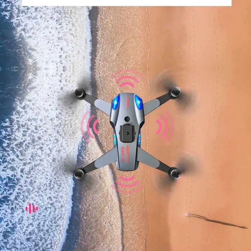 K911 SE drone hovering above a beach for coastal aerial photography, holiday filming, and outdoor adventure shots.