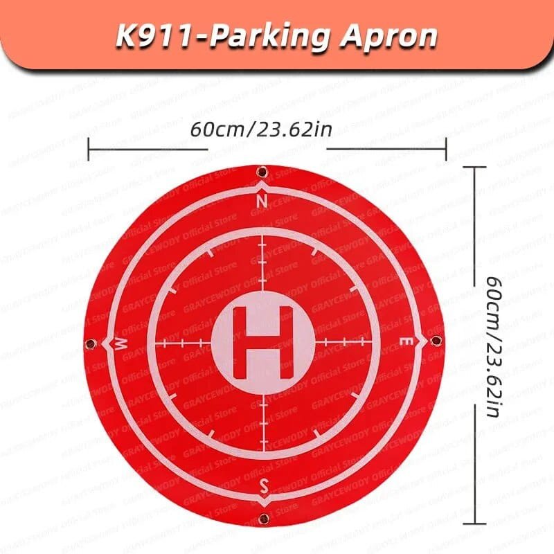 Red foldable drone landing pad with measurements for safe K911 SE takeoff and landing on grass, sand, or dirt.