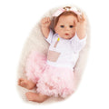 Kaliyah 21 Inch Silicone Reborn Baby Doll in a white outfit with pink ruffled skirt for nursery display.