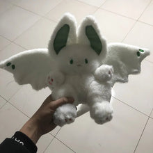 Kawaii Bat Manta plush toy with soft bat wings held on a tiled floor for everyday cuddly play.