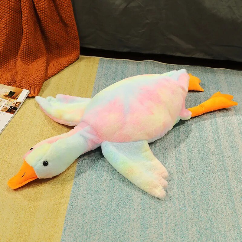 Plush toy duck on a textured surface 