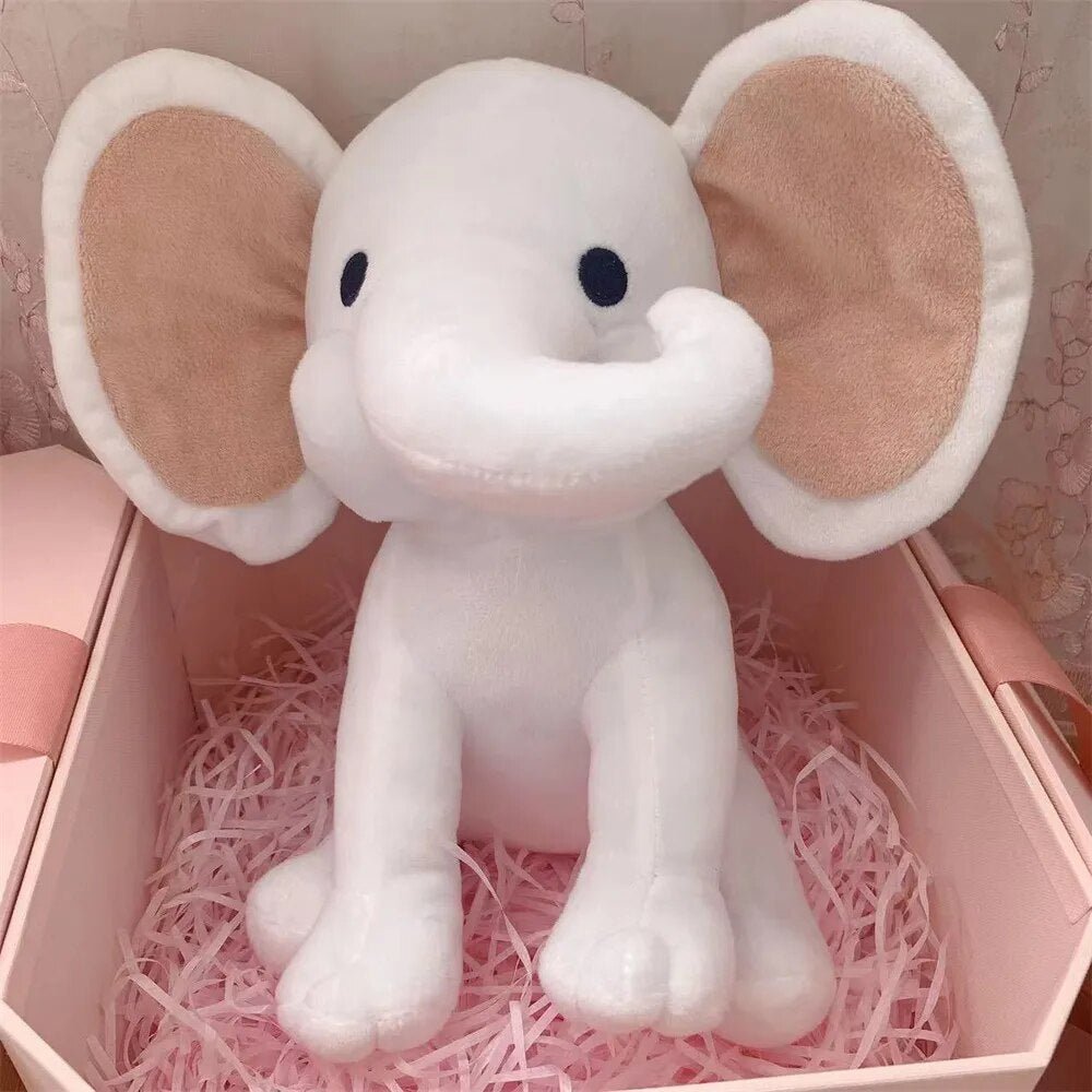 Kawaii Elephant plush toy in white shown inside a pink gift box for newborn gifting and nursery decor.