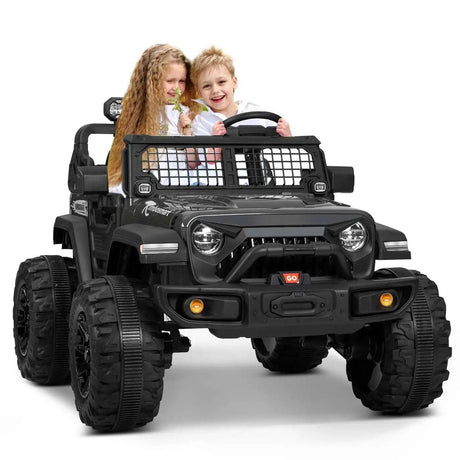 Children playing in a black toy jeep 