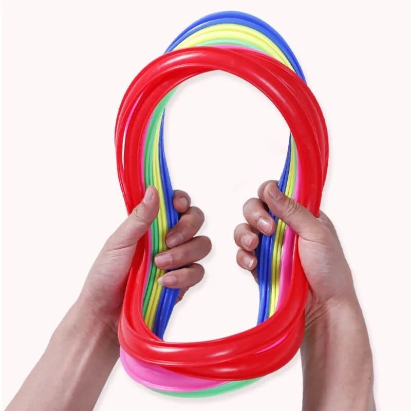 Colorful rubber bands held by two hands.
