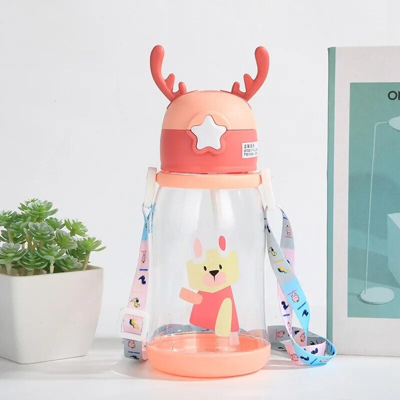 Kids antler sippy cup with deer antler lid design on a white surface, a fun leakproof drinking cup for toddlers.