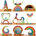A collage of colorful wooden toys, including arches, a bicycle, and rings, on a wooden surface.