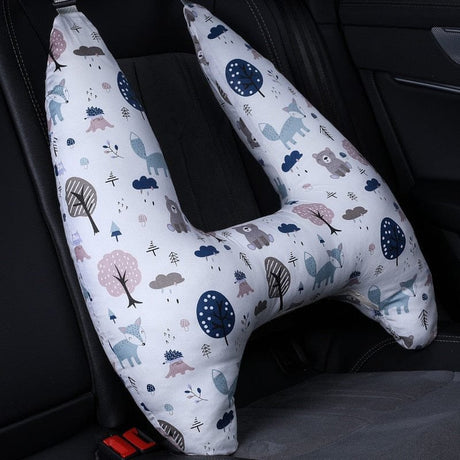 U-shaped car pillow with animal and nature pattern on a car seat