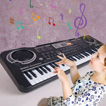 Child playing a kids toy keyboard surrounded by musical notes graphics, encouraging early music learning.