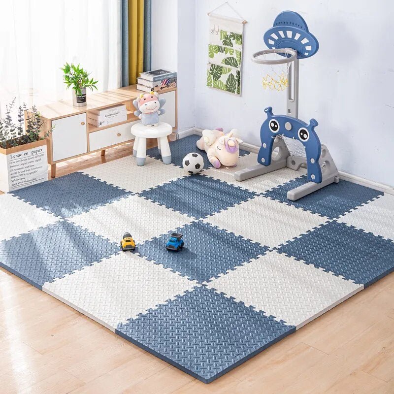 Kids Foam Puzzle Play Mat in blue and white set up as a multipurpose playroom floor for kids' activities.