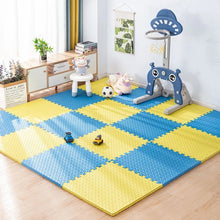 Kids Foam Puzzle Play Mat in blue and yellow set up with a play gym for baby tummy time and crawling.