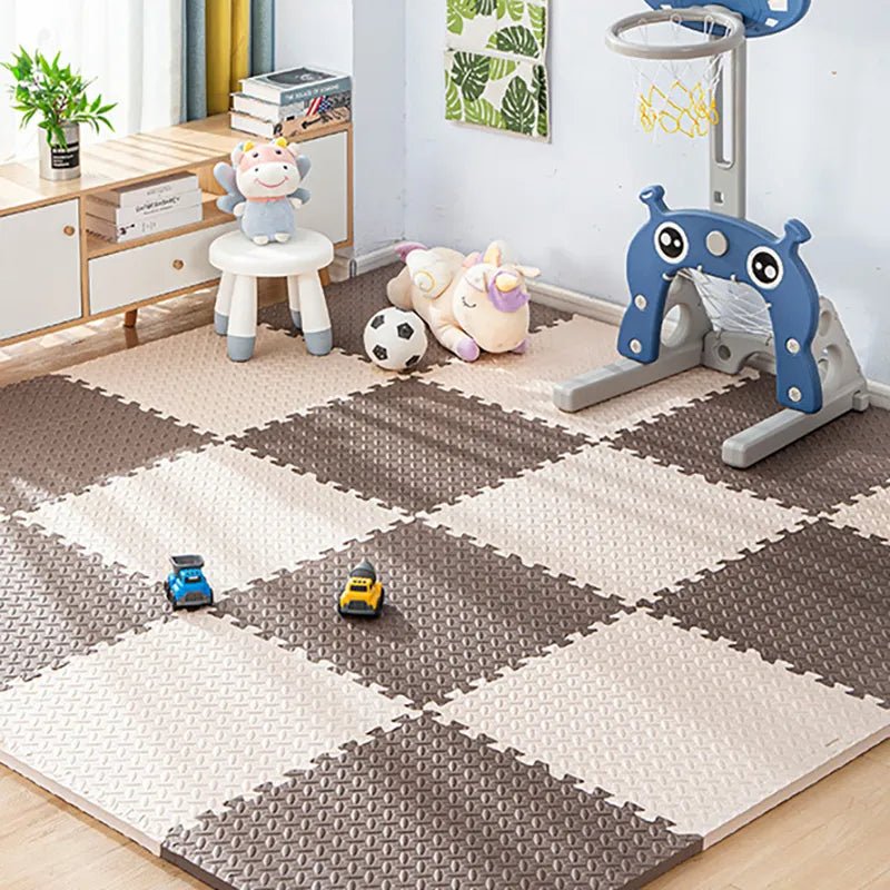 Kids Foam Puzzle Play Mat interlocking tiles set up as a home gym floor for kids' active play.