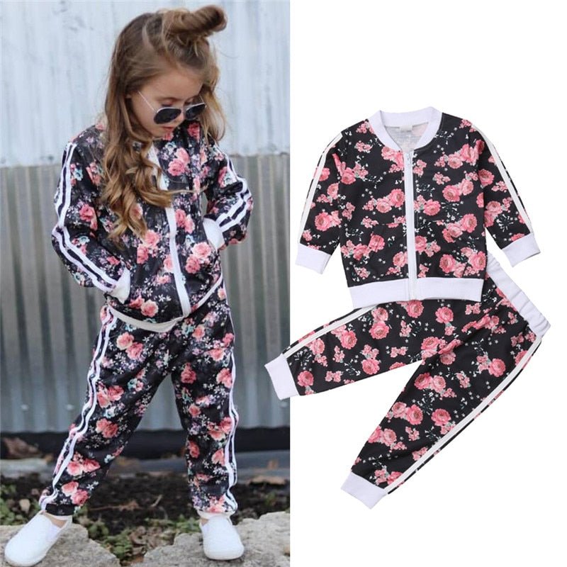 Kids girl floral clothes set detail showing the print and sleeve cuffs for comfortable long sleeve everyday wear.